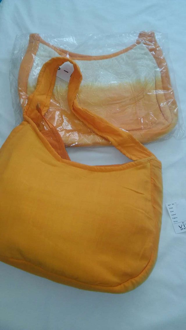 Bolso naranja nuevo sin usar