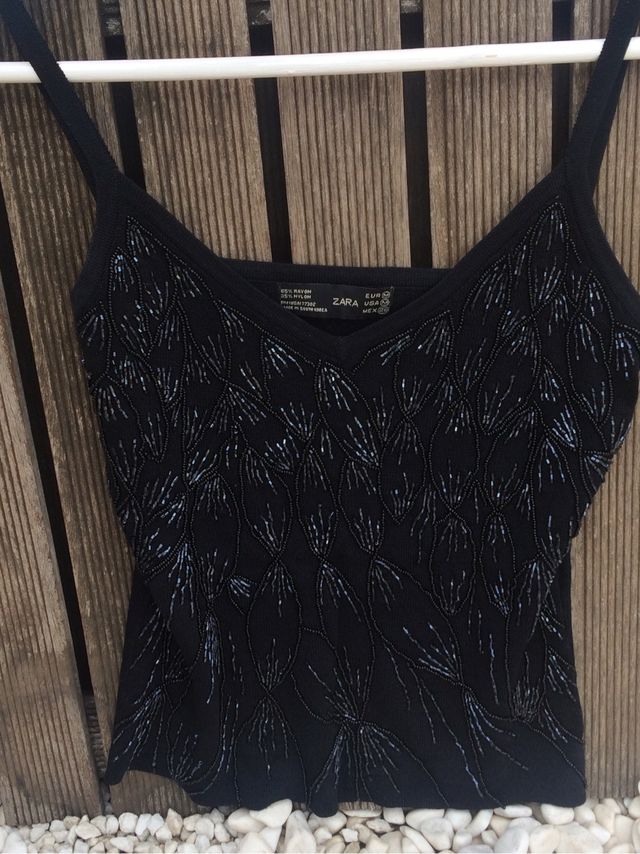 Top negro de pailettes