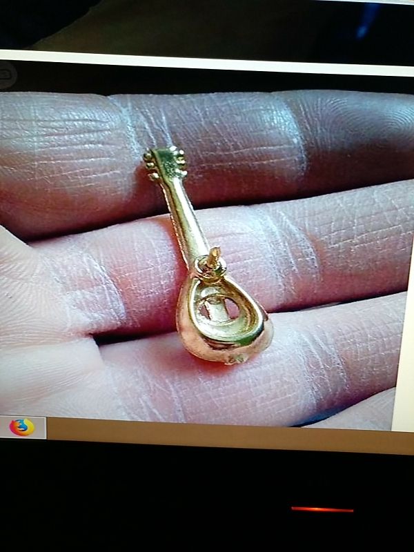 Pin de guitarra, mandolina.