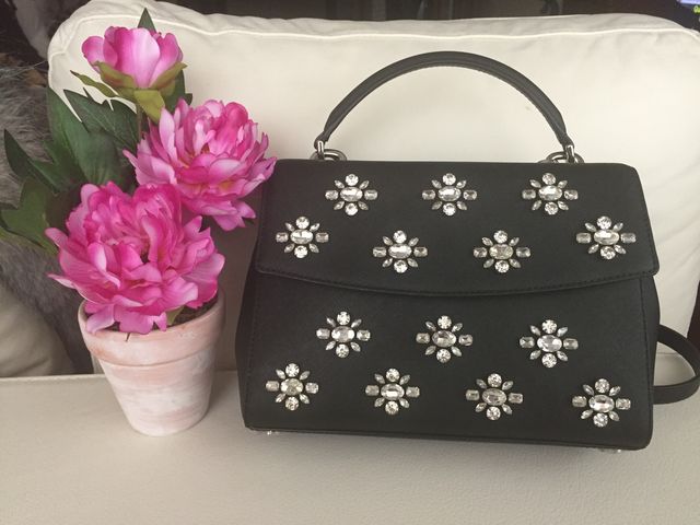 Bolso Michael Kors de piel y flores de cristal