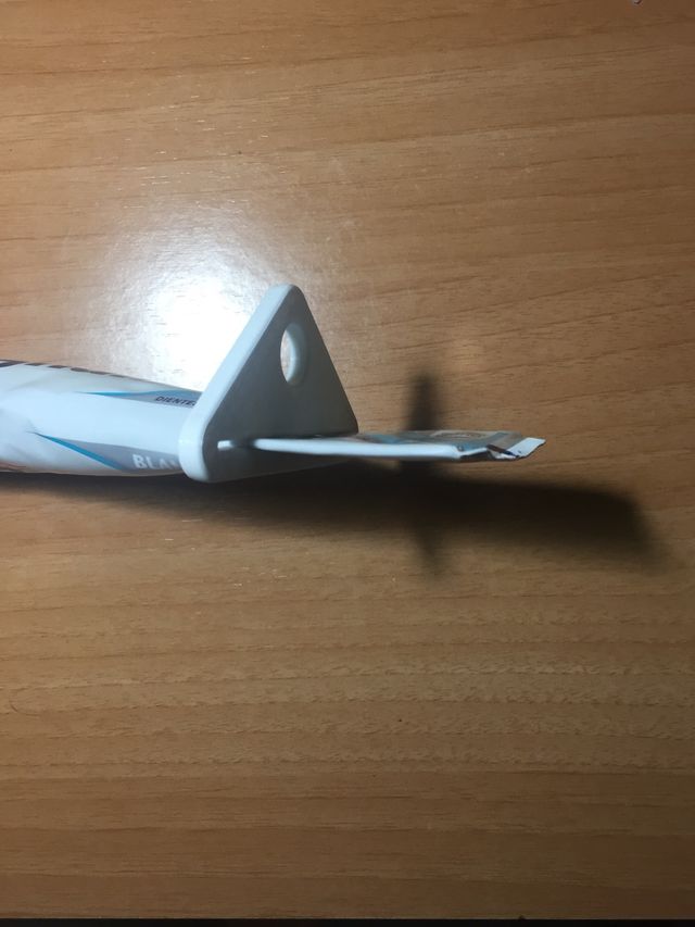 Pieza para exprimir la pasta de dientes