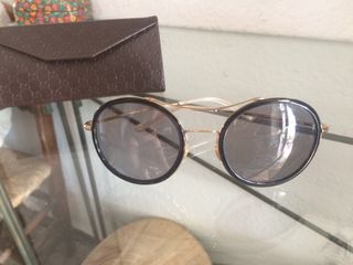 gafas gucci doradas