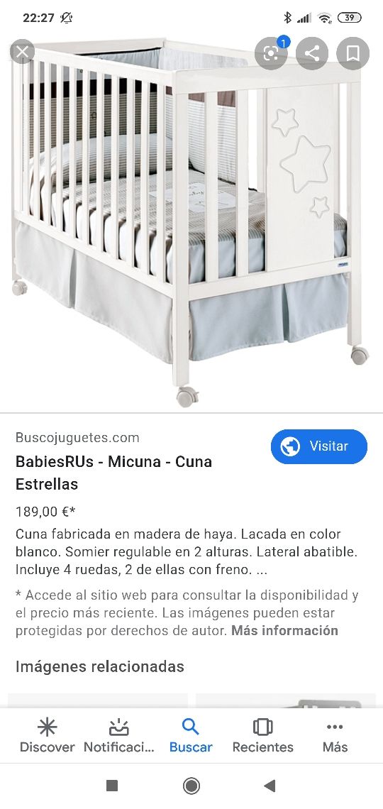 cuna de madera blanca con estrellas