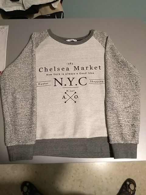 Jersey chica en grises de Mango