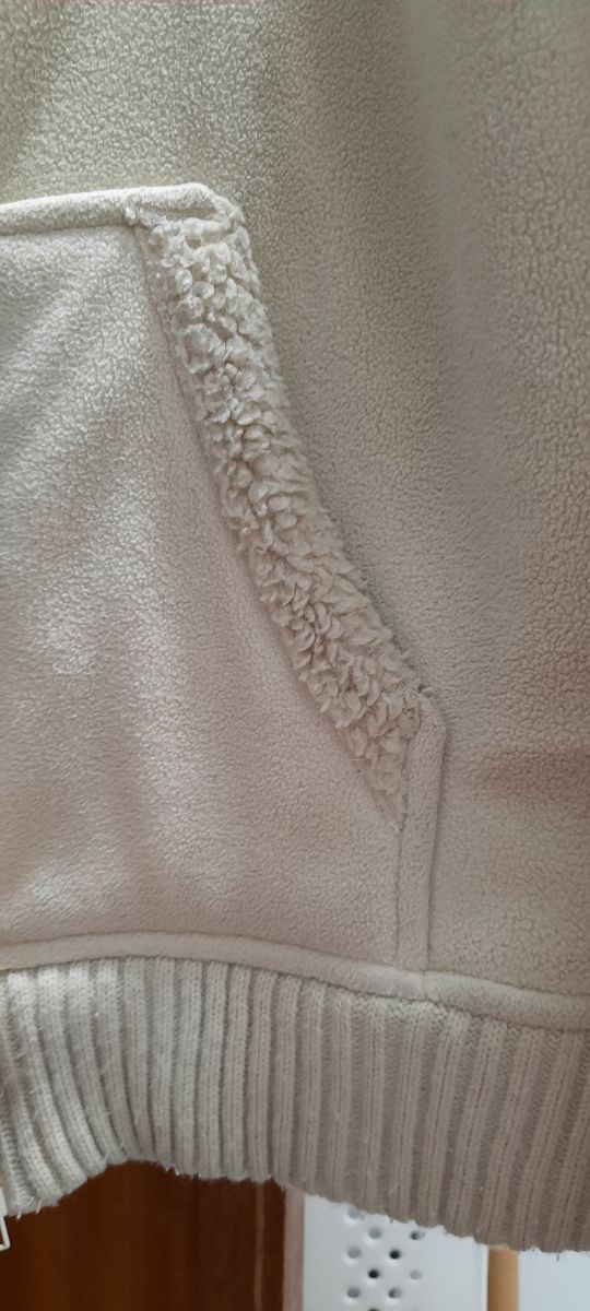 Casaco de ovelha pequena.