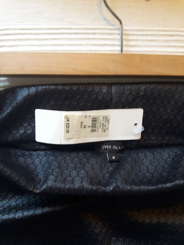 Lote falda de tubo negra a estrenar y top cadena