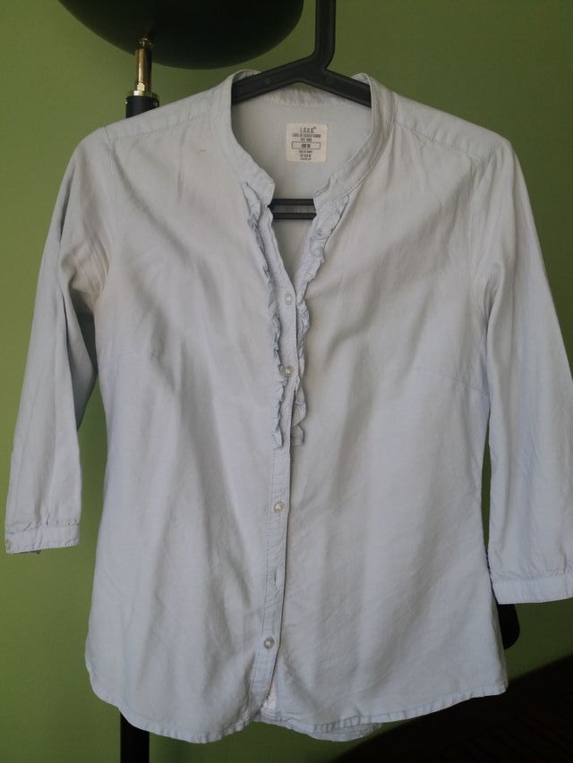 Camisa femenina color azul.celeste marca hym