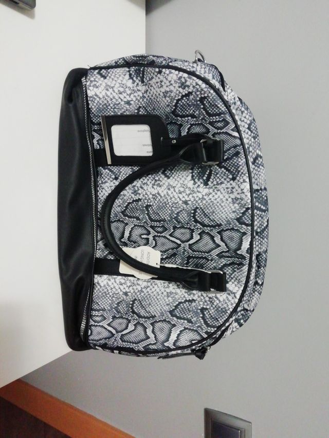 mochila de viaje animal print