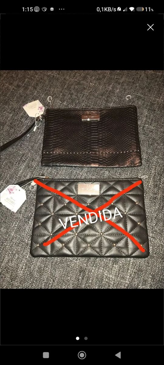 Bolso cartera de mano.