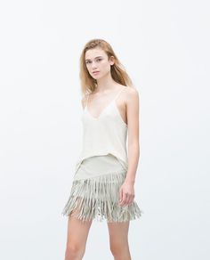Minifalda flecos