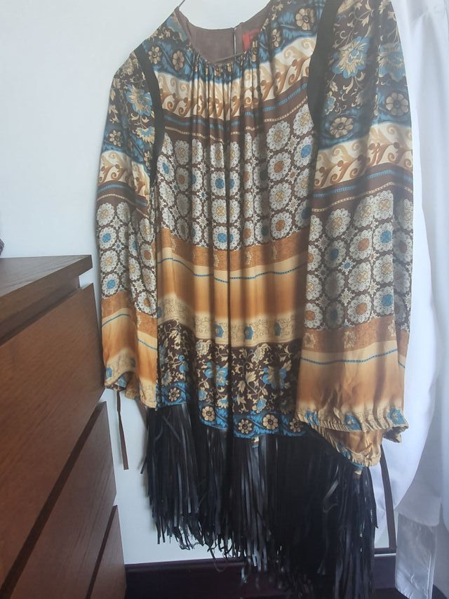 Precioso vestido .No arruga.Impresionante tejido