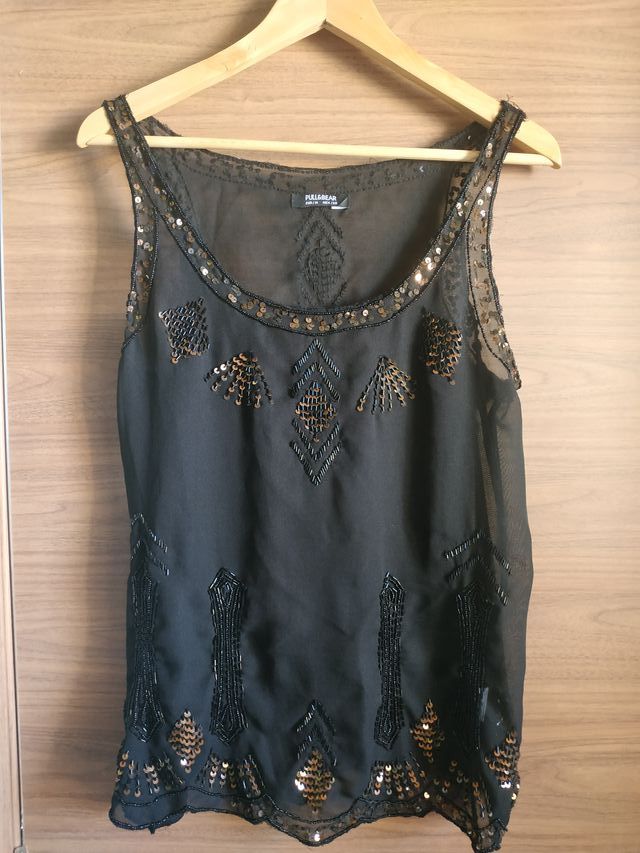 Blusa negra festiva