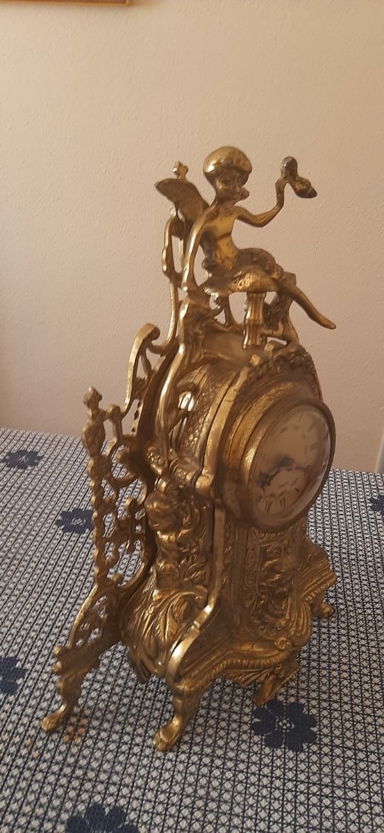 Reloj y candelabros bronce