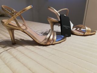 Sandalias doradas cortefiel de segunda mano por 28 EUR en Jaén en WALLAPOP