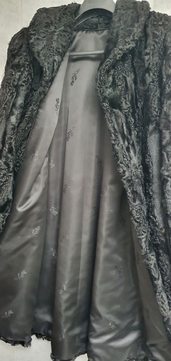 Abrigo de garras de astracán