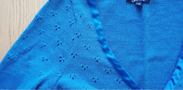 Chaqueta torera con lazos de raso.Stradivarius.