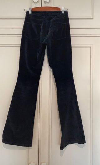 Pantalones campana color rosado efecto desgastado de segunda mano –  it.closet