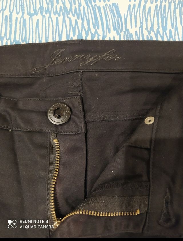 Pantalón vaquero acampanadnegro Jennyfer talla 40.