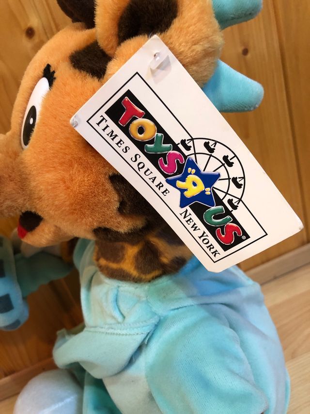 Giocattolo peluche ToyRus giraffa «statua della libertà» NY