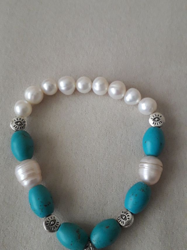 pulsera con colgante de pez