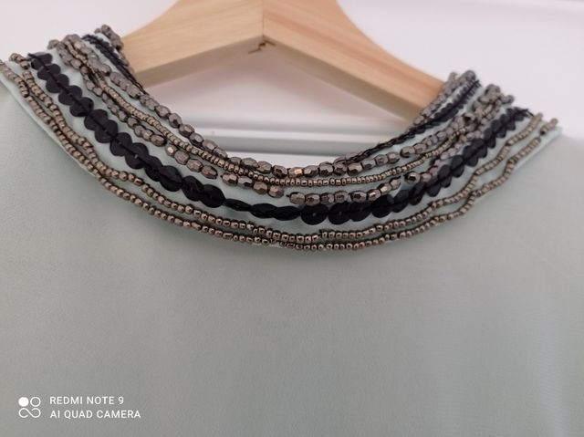 Blusa verde agua de gasa con detalles