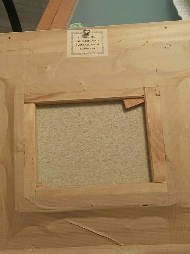 Cuadro con pintura al óleo enmarcada.