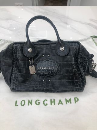 Bolso Longchamp piel efecto serpiente de segunda mano por 120 EUR en Madrid  en WALLAPOP
