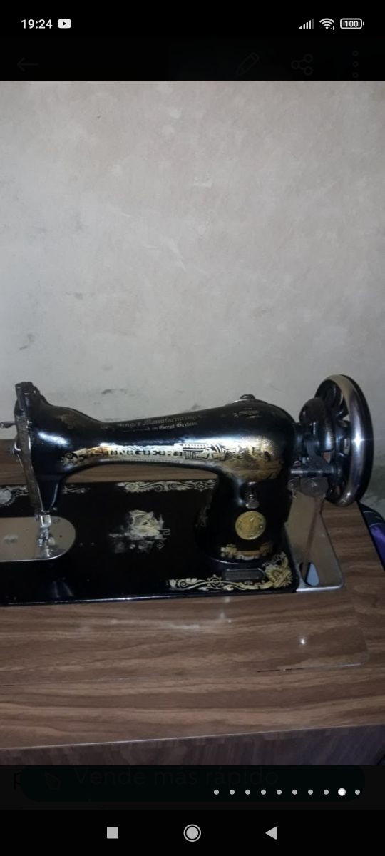 maquina de coser antigua y funcionando