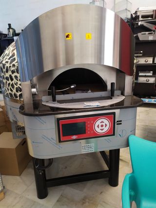 Horno pizzero rotatorio hibrido gas y leña de segunda mano por 10.950 EUR  en Granada en WALLAPOP