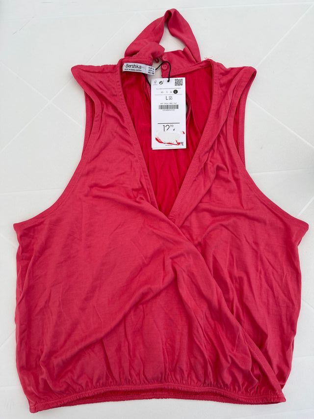 Top rosa atado al cuello