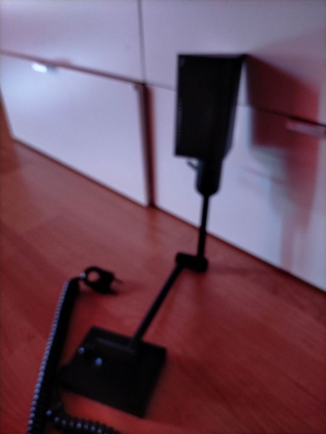 Lámpara de pared con brazo extensible.