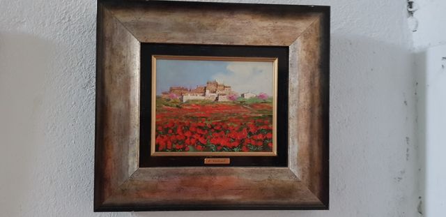 Cuadro Carbonel. Pueblo fondo y flores rojas