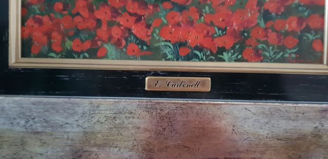 Cuadro Carbonel. Pueblo fondo y flores rojas