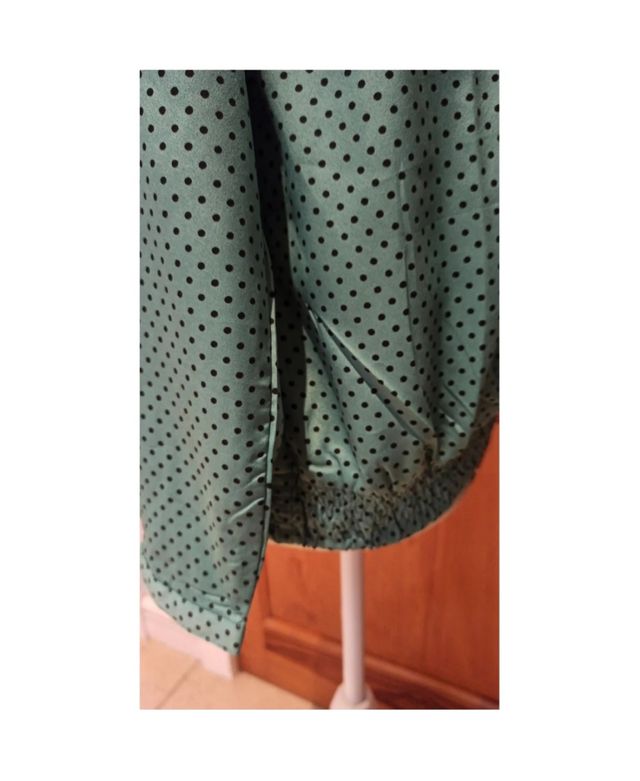 Blusa aguamarina manga larga con lunares negros