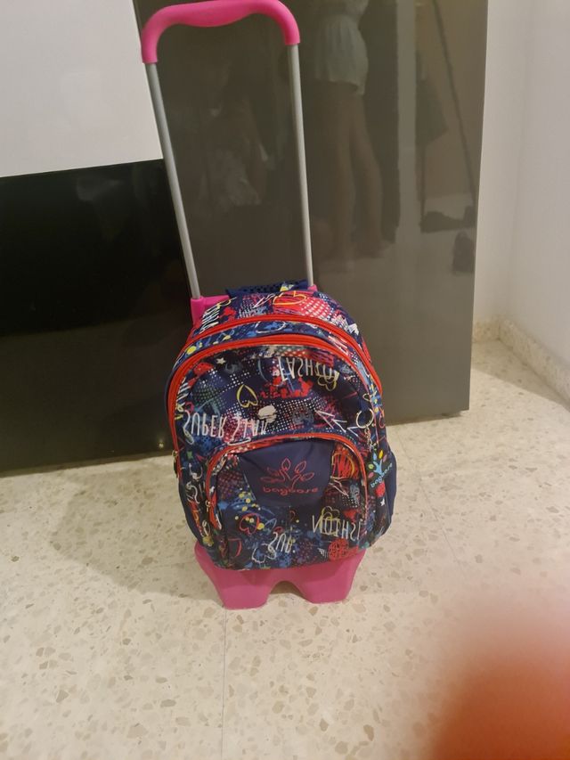 vendo mochila de colegio y soporte con ruedas