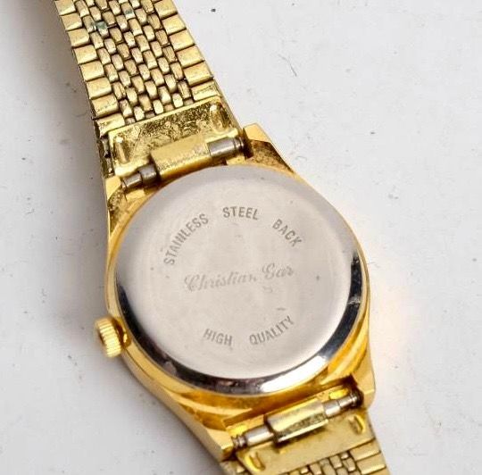 Antiguo Reloj de pulsera de mujer dorado.