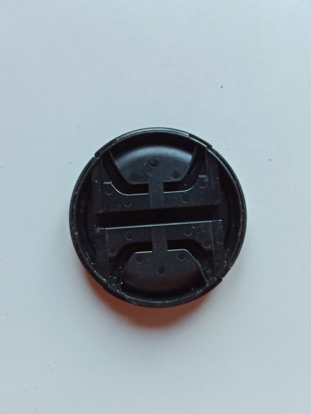 tapa frontal Olympus 57mm