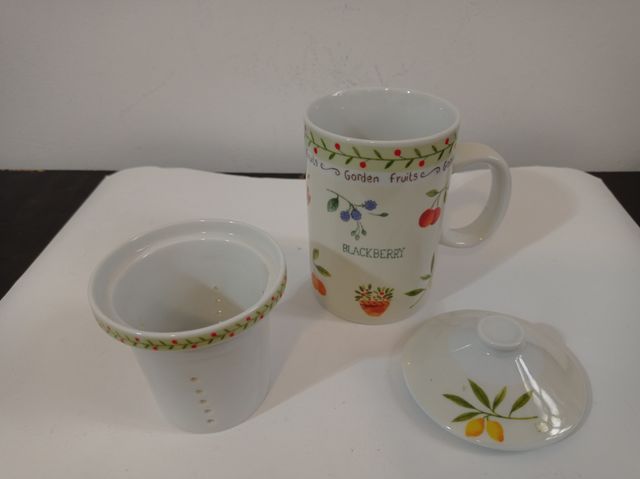 Taza de té con tapa y colador