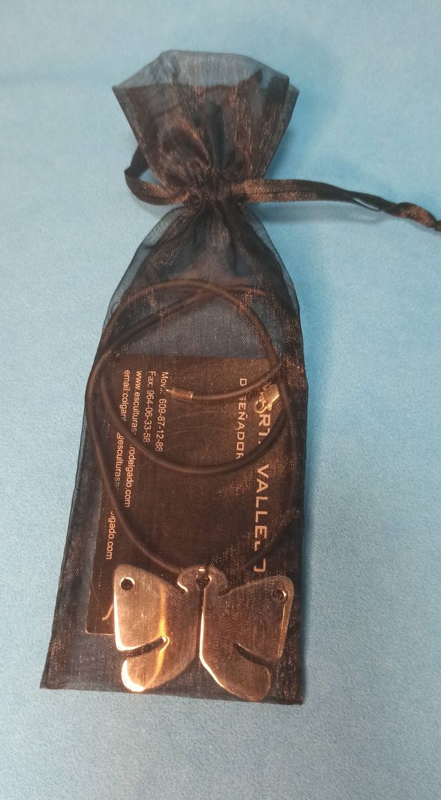 Colgante de mariposa en acero nuevo