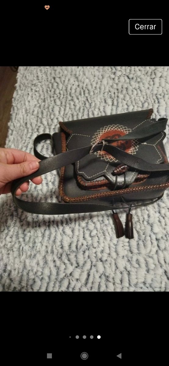 bolso de cuero artesanal hecha un ojo