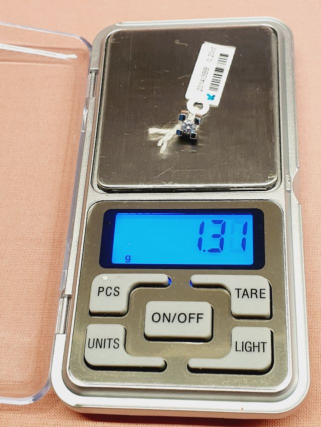 Colgante 0.18kl oro blanco  diamante VSI