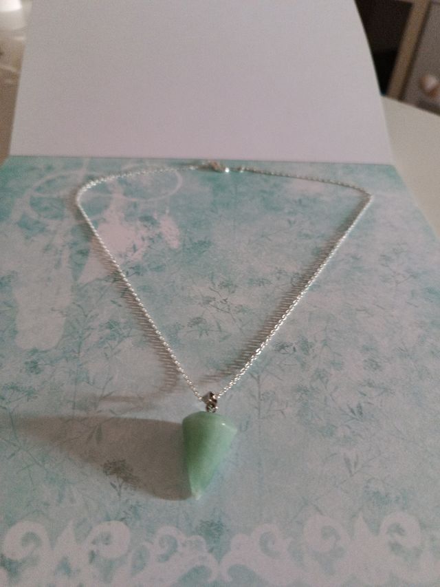 péndulo con cadena de plata