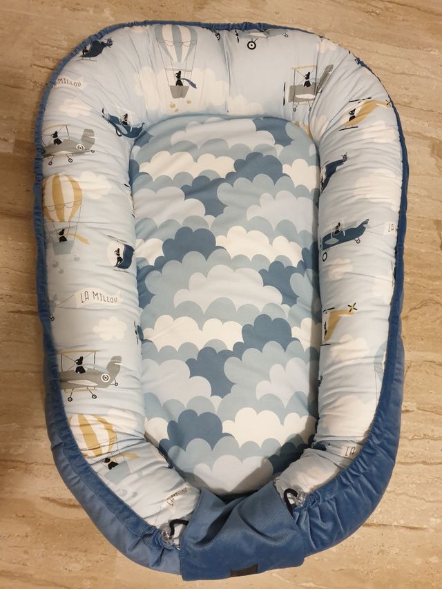 Nido reductor de cuna.