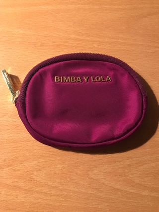 Monedero Bimba y Lola redondo color fucsia vino de segunda mano por 16 EUR  en Valencia en WALLAPOP