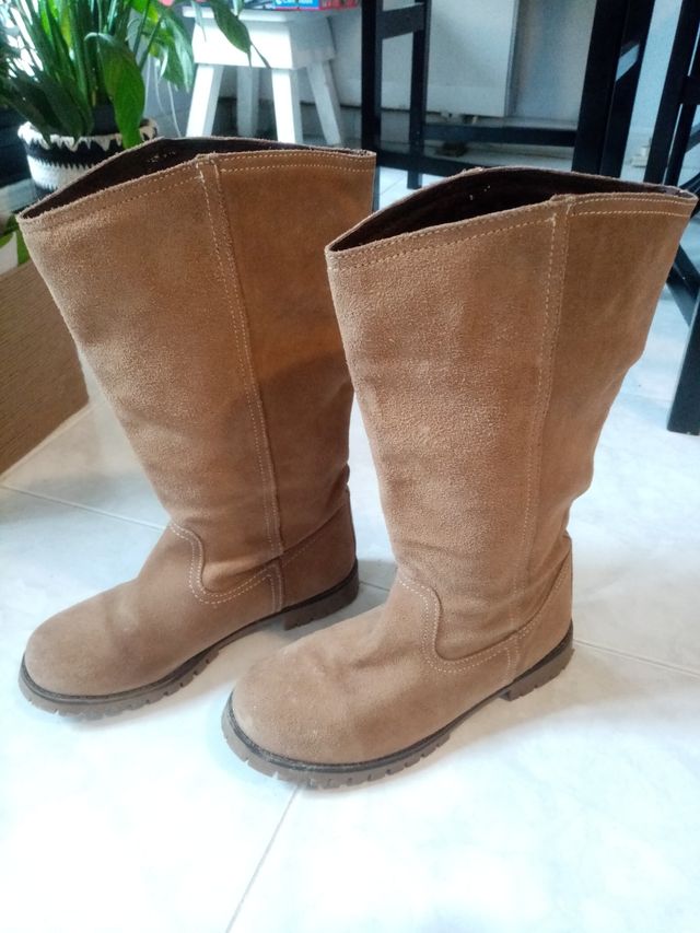 Botas altas.