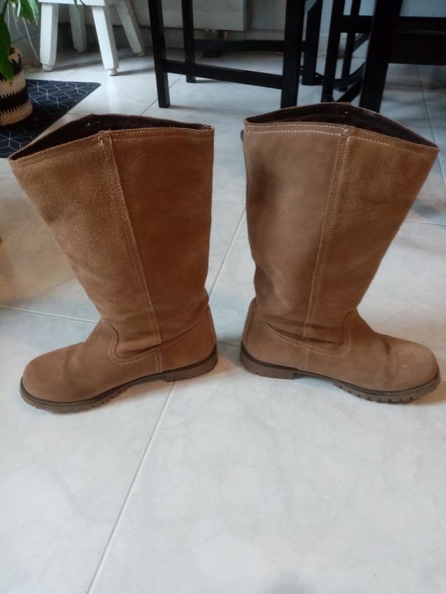 Botas altas.