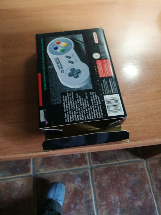 Caja con mando súper nintendo
