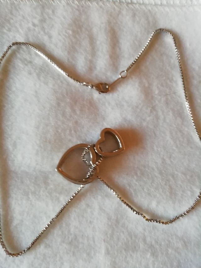 Colgante doble corazón. Acero.Nuevo