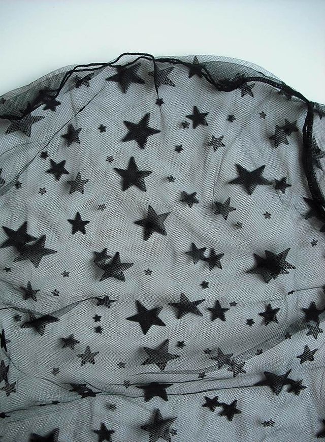 Top negro de estrellas