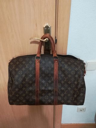 Maleta de viaje Louis Vuitton de segunda mano en WALLAPOP